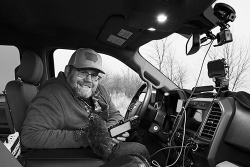 Clarence Smith in his chase vehicle with camera gear
